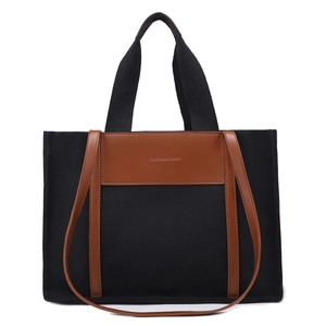 Minimalist canvas tote bag with brown leather trim and large capacity in black color