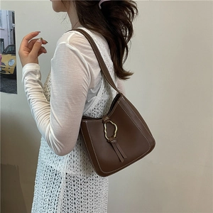 Retro brown leather underarm bag with contrast stitching and golden metal buckle accessory
