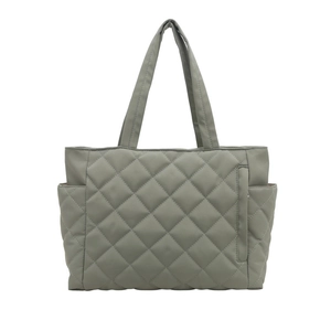 Minimalist green quilted tote bag with diamond stitching and multiple functional pockets