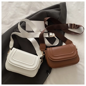 Detail of saddle bags featuring U-shaped texture and wide nylon shoulder straps