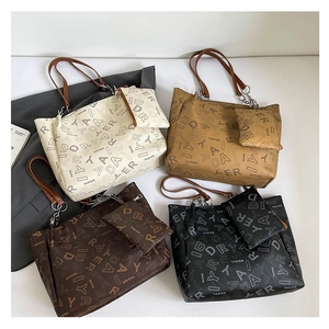 Minimalist printed tote bag set in four colors with matching coin purses and chain straps