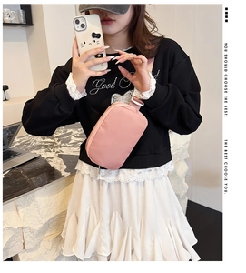 Pink nylon crossbody bag with adjustable strap shown on model for daily casual wear