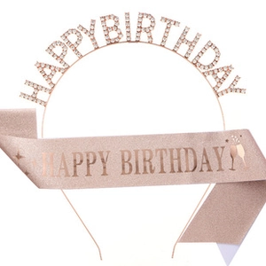 Detail of rose gold rhinestone crown headband and pink glitter happy birthday sash set