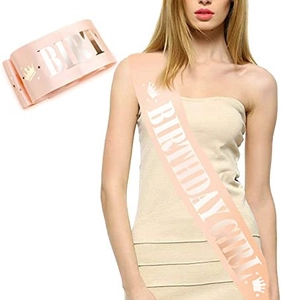 Detail of champagne pink satin Birthday Girl sash with rose gold lettering and crown design