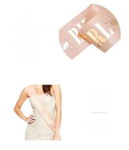 Detail of champagne gold satin sash with BIRTHDAY GIRL golden foil print and crown