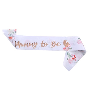 Close-up of Mummy to Be sash with rose gold foil lettering and pink floral patterns