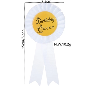 Detailed view of Birthday Queen ribbon badge with white satin petals and golden crown logo