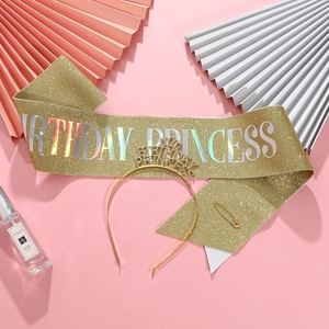 Close-up of golden glitter Birthday Princess sash and headband set for girls' parties