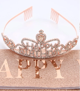 Macro shot of rose gold Happy Birthday crown with teardrop crystal and rhinestone pavé