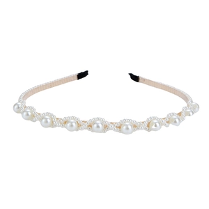 Elegant gold metal headband with alternating white pearls in a wavy handmade design
