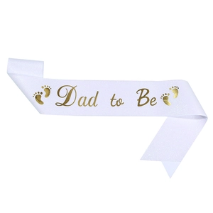 Glittery white 'Dad to Be' sash with gold lettering and baby footprints for baby showers