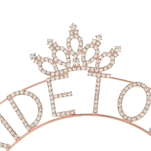Detailed view of rose gold Bride To Be headband with shimmering white rhinestones