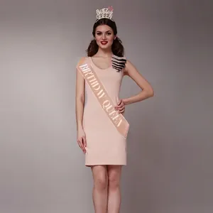 Rose gold Birthday Queen sash and crown tiara set worn by a model in a pink dress