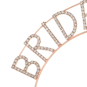 Macro view of rose gold BRIDE tiara headpiece with sparkling rhinestone inlay