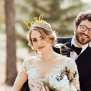Close-up of a glittering gold Bride headband with a diamond icon for wedding parties