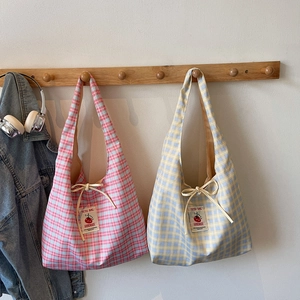 Checkered large capacity tote bag in pink and blue plaid with handmade label detail
