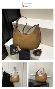 Detail view of brown faux suede hobo bag with adjustable straps and zipper closure
