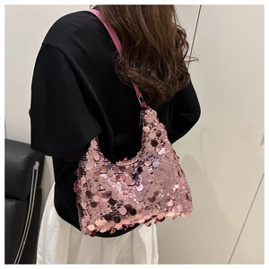 Detail showing pink sequin texture on hobo shoulder bag with fish scale pattern