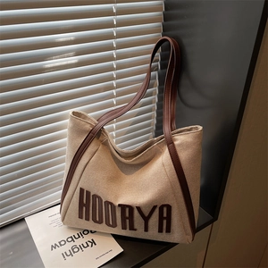 Chic beige canvas tote bag with large HOORYA letter patch and leather straps