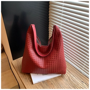 Detail of red woven hobo bag showing high-quality texture and large capacity design