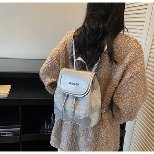 Detail of silver PU mini backpack with 'Enjoy Life' print and chic chain strap