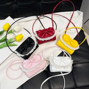 Sweet mini crossbody bag with large bow and lace trim in five vibrant colors
