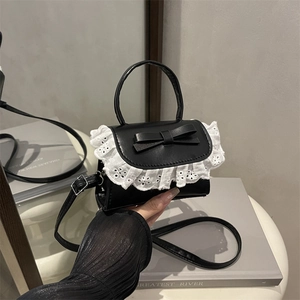 Chic black PU leather mini crossbody bag with white lace trim and bow knot detail