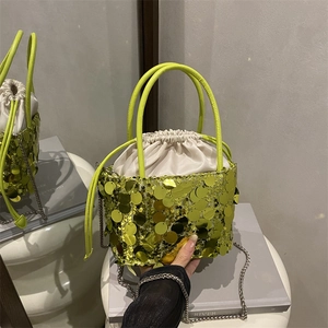 Neon green sequin bucket bag with drawstring closure and silver chain strap for women
