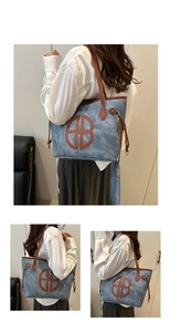Detail of blue denim tote bag featuring brown leather trim and circular B logo cutout