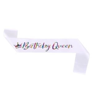 White satin Birthday Queen sash with colorful gradient lettering and a crown icon