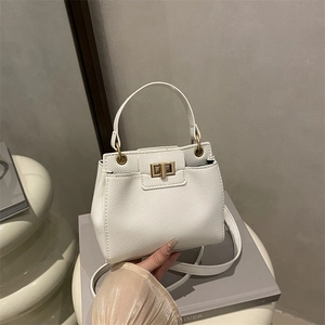 White lychee pattern leather handbag with gold metal lock and crossbody strap