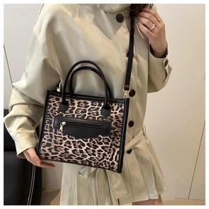 Detail showing high-quality leopard print pattern on a chic rectangular crossbody bag