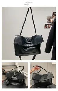 Detail of black PU leather tote bag with thick braided rope handle and soft texture