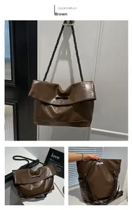 Detail of brown soft PU tote bag featuring woven rope strap and minimalist cutout handle