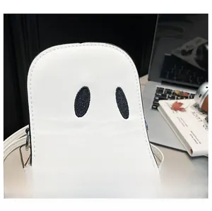 Close-up of white PU leather crossbody bag featuring a minimalist ghost face embroidery
