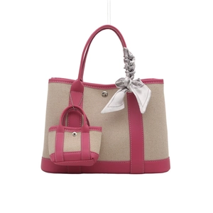 Canvas contrast tote bag with pink leather trim and a decorative patterned silk scarf