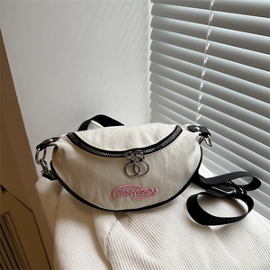 Minimalist cream canvas crescent chest bag with pink embroidered letters and metal zippers