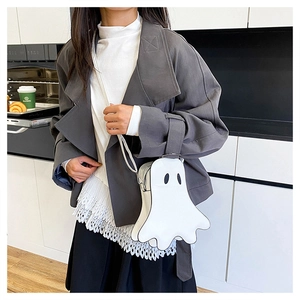 Ghost-shaped PU leather crossbody bag shown on model in a modern lifestyle setting