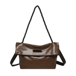 Brown soft PU leather tote bag with chain strap and adjustable wide strap on white background