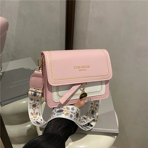 Pink and white color-block leather crossbody bag with floral strap and V-shaped stitching