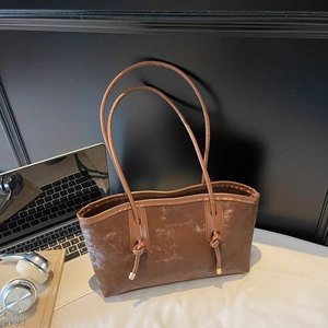 Retro brown leather tote bag with knotted shoulder strap for daily work commute