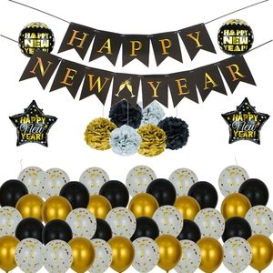 Macro detail of Happy New Year party set with black gold swallowtail banners and balloons