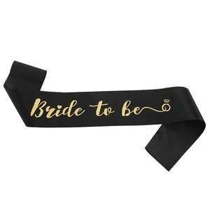 Detail of black satin bachelorette sash with gold foil Bride to be text and ring icon