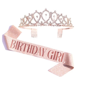 Close-up of rose gold rhinestone crown and glittery Birthday Girl sash for 21st birthday