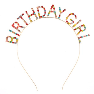 Close-up of birthday girl headband featuring colorful rhinestones and gold metal frame