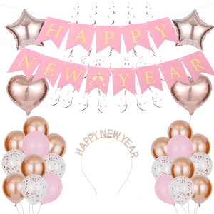 Rose gold Happy New Year banner set with foil balloons and decorative hanging swirls