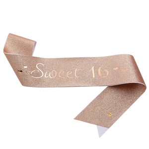 Rose gold glitter Sweet 16 sash with gold safety pin for birthday party celebrations