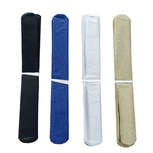 Close-up of Happy New Year paper party tassels in black, blue, silver, and gold colors