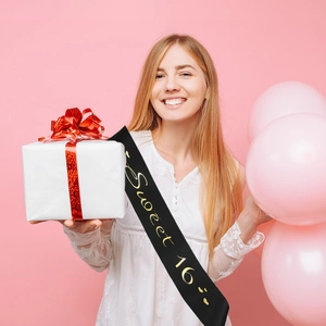 Elegant Sweet 16 black satin sash with gold foil lettering for birthday party celebration