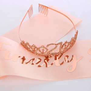 Close-up of rose gold crystal 21st birthday tiara and Finally 21 pink satin sash
